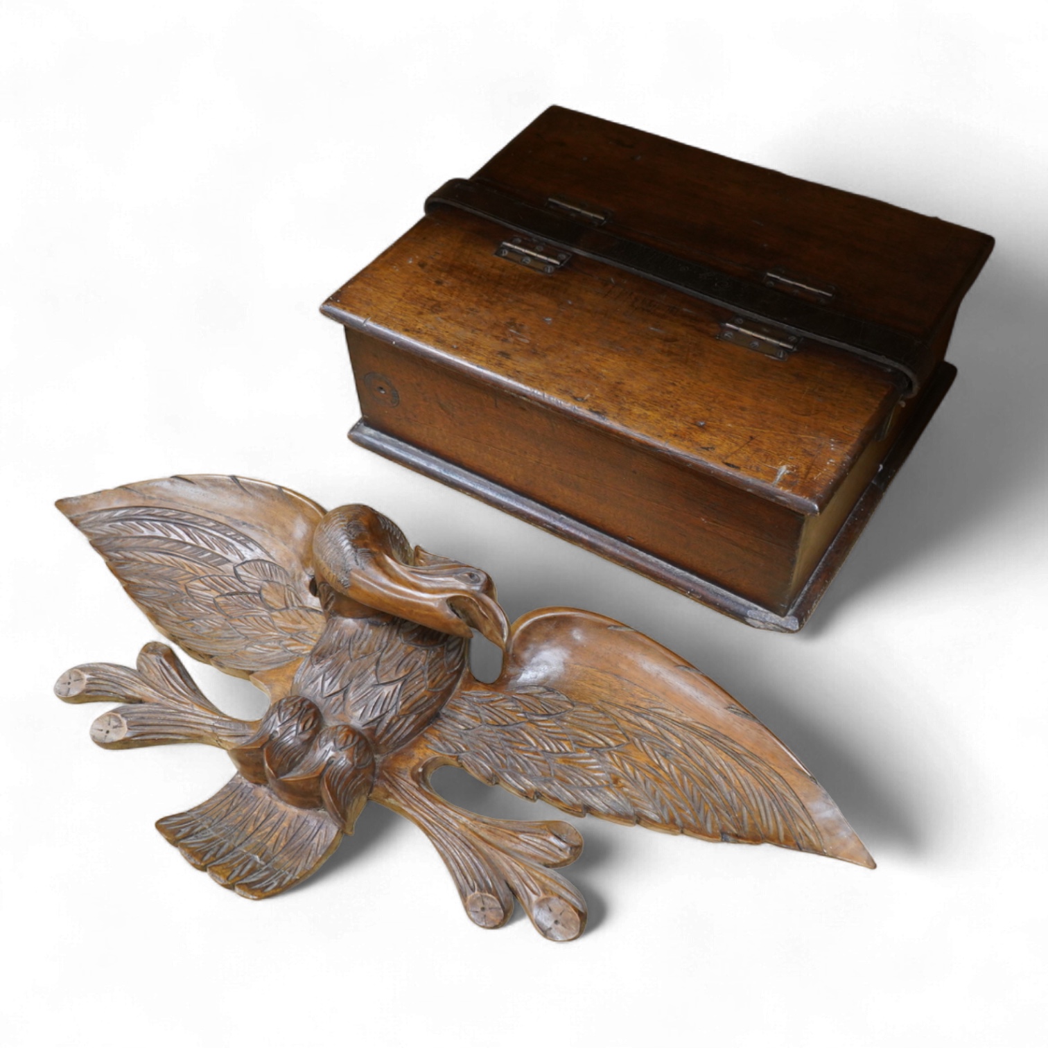 A mahogany leather-handled tool box and carved American eagle wall mount, largest 66cm wide
